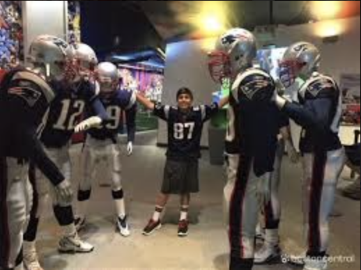 A child meeting the Patriots team